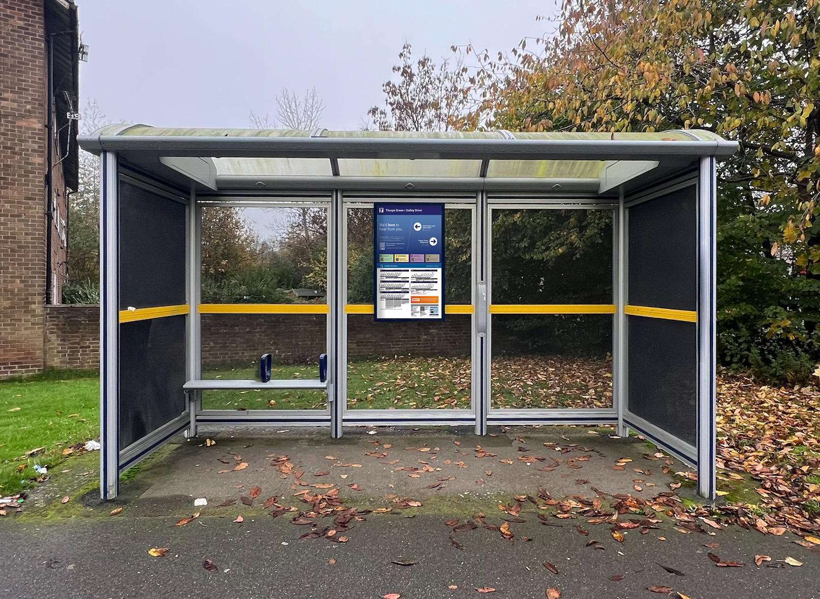 Photo of a bus shelter with a poster case which has the new poster inside