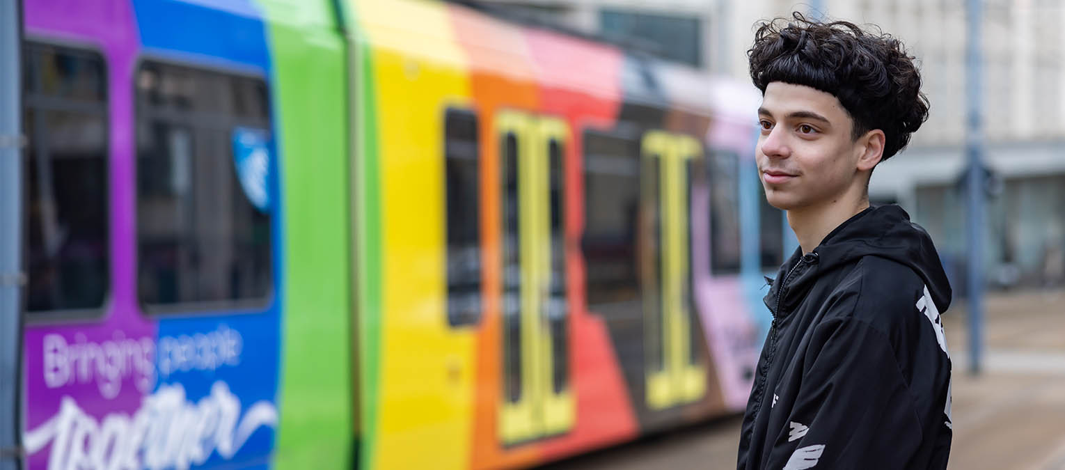 Boy waiting for tram