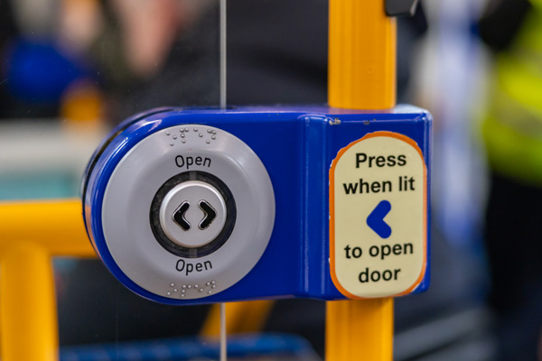 Photo of a door open button inside the tram