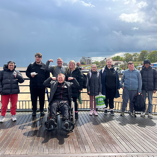 Young people and volunteers on Community Rail Trip to Cleethorpes