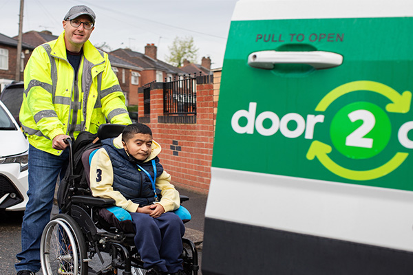 Man pushing boy in wheelchair