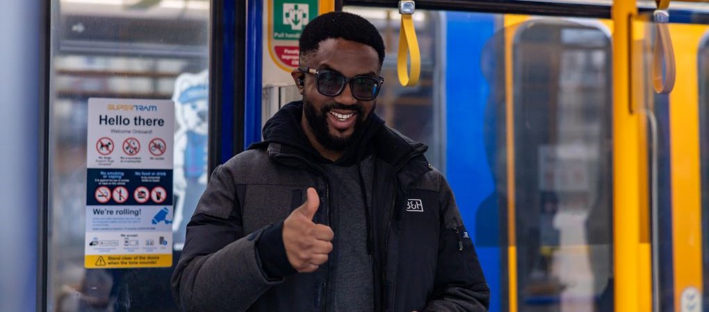 A Supertram customer making the 'thumbs up' sign