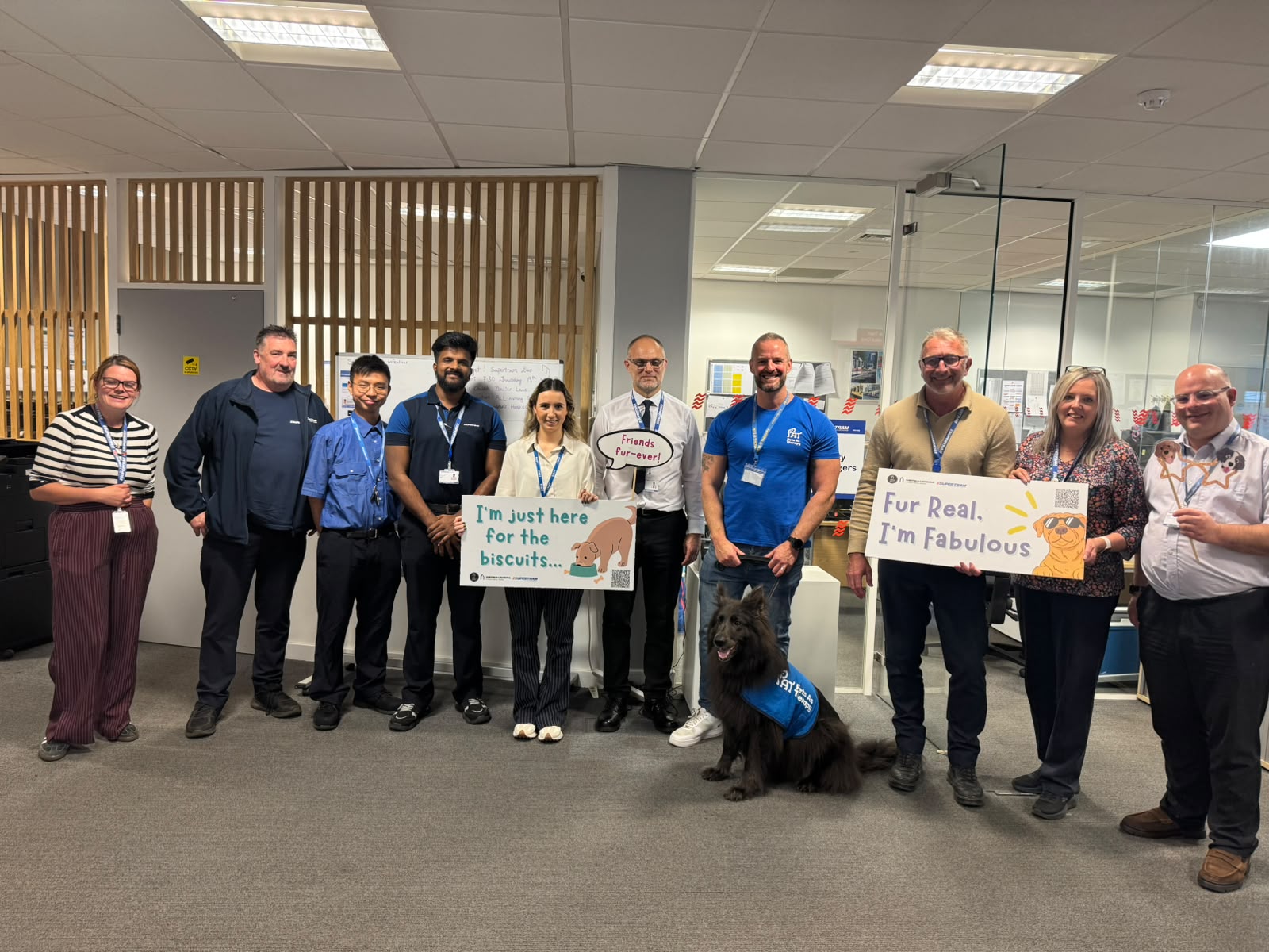 Steve O’Callaghan with therapy dog Nya alongside Supertram colleagues