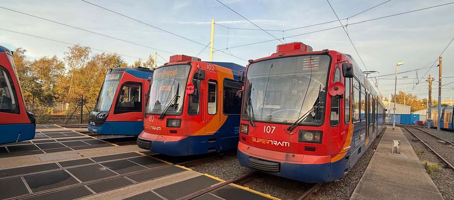 Supertram vehicles displaying red poppies on the front.