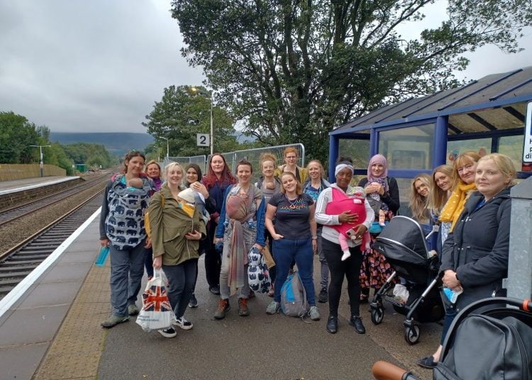 Women and children standing on a station platform